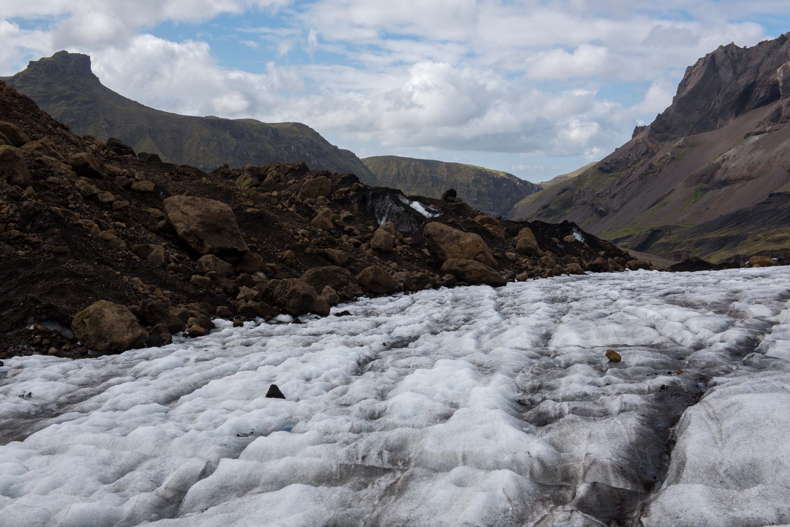 What appears to be a layer of rocks many meters thick, is actually thicker ice with a thin layer of stones.