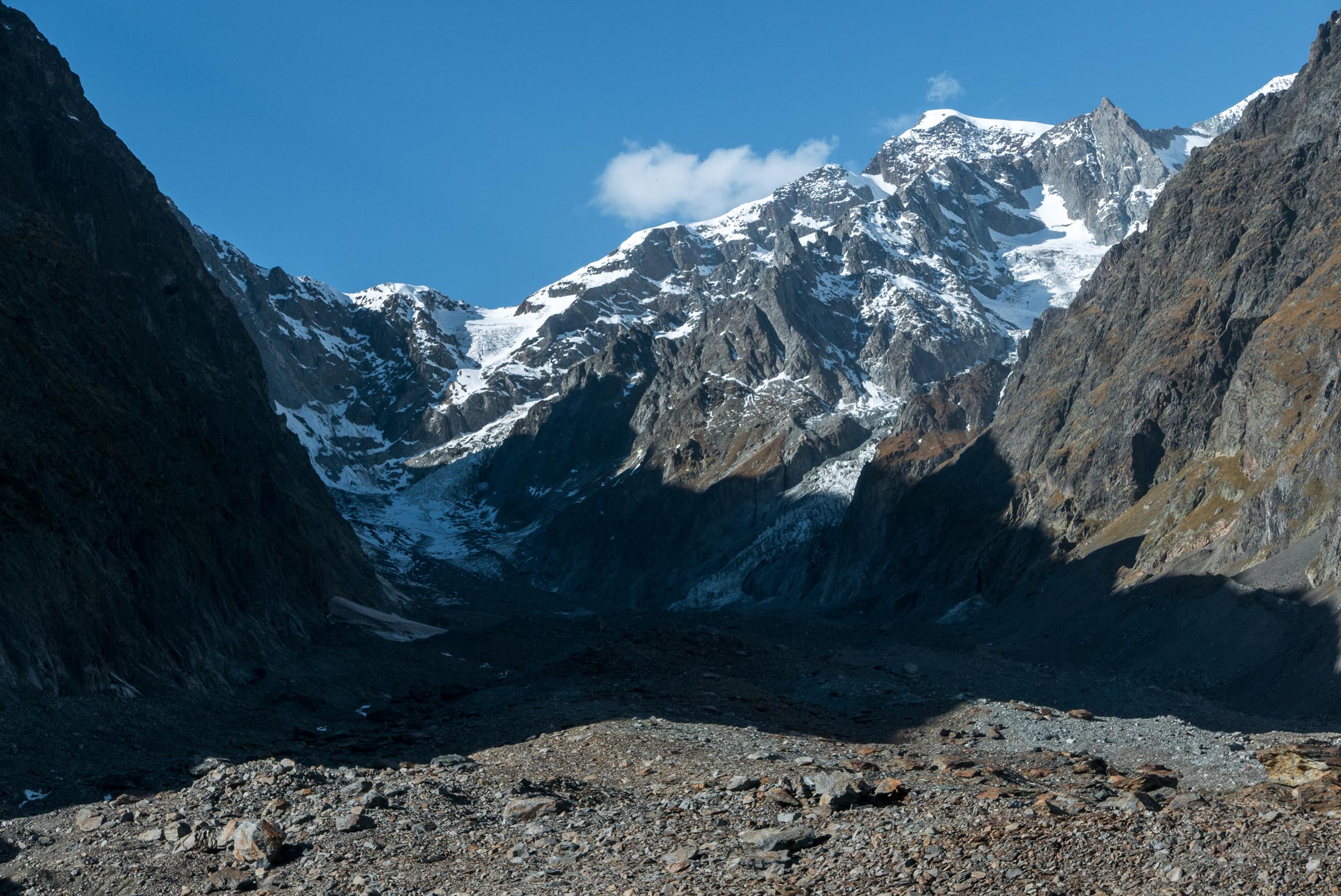 Glacier du Miage is surrounded by steep mountains, October 2022.