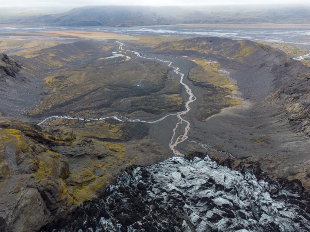 The arcuate moraine surrounds the basin. Drone photo, August 2023.
