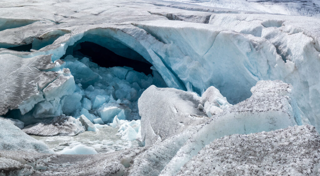 Meltwater cave of Mandrone Glacier, the main snout of Adamello.