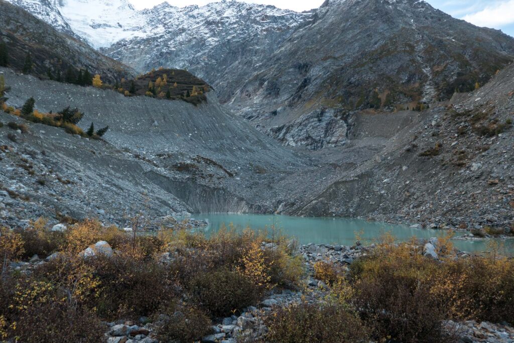 The melting snout is being replaced by a lake. Notice the high lateral moraines.