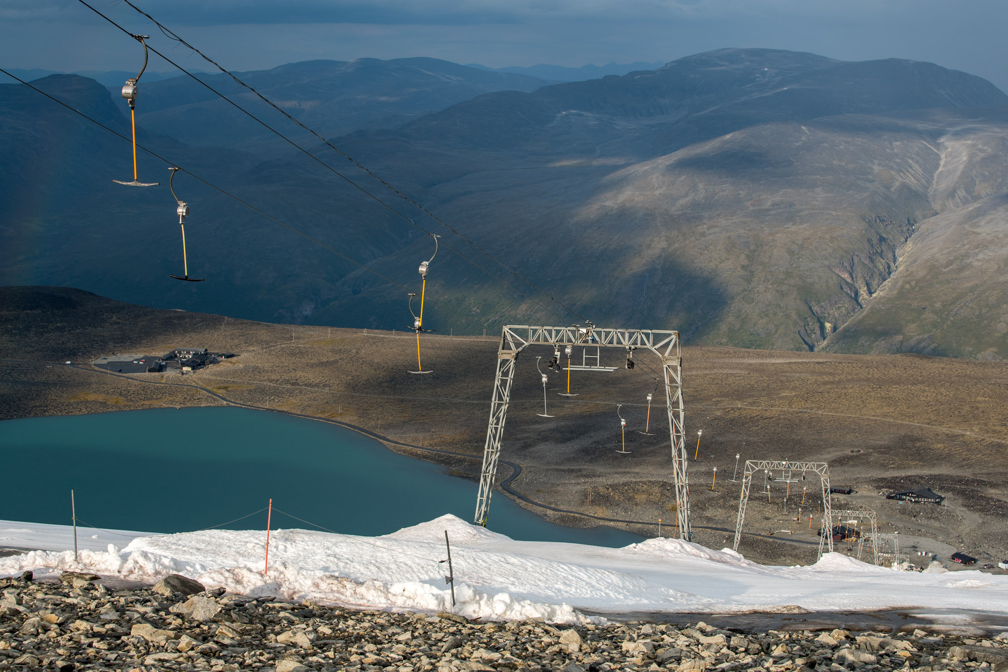 Ski lift on Vesljuvbreen. Juvvatnet down below.