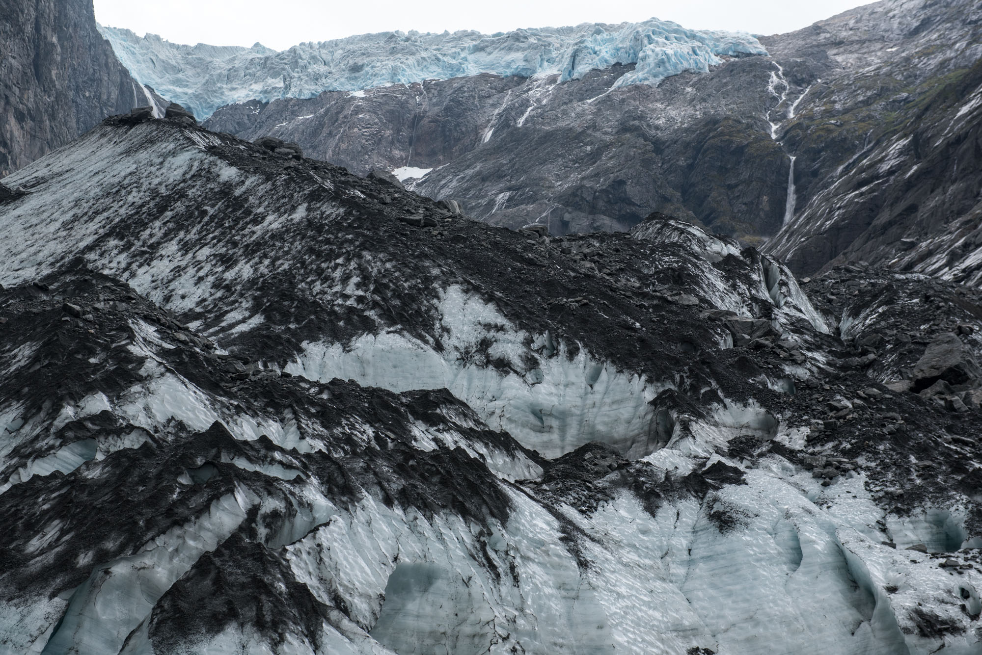 Stones cover the glacier.