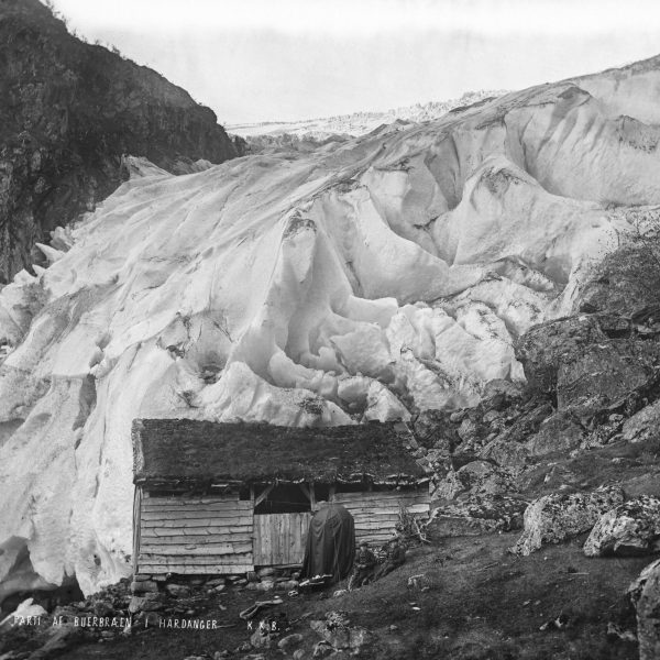 The advancing Buerbreen is getting dangerously close to a shed in 1870-1871. Photographer: Knud Knudsen, University of Bergen Library document ubb-kk-1318-0502.